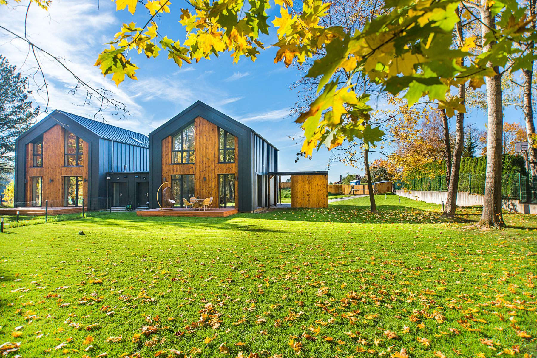 Agricultural style dwellings with standing seam cladding and timber gable ends