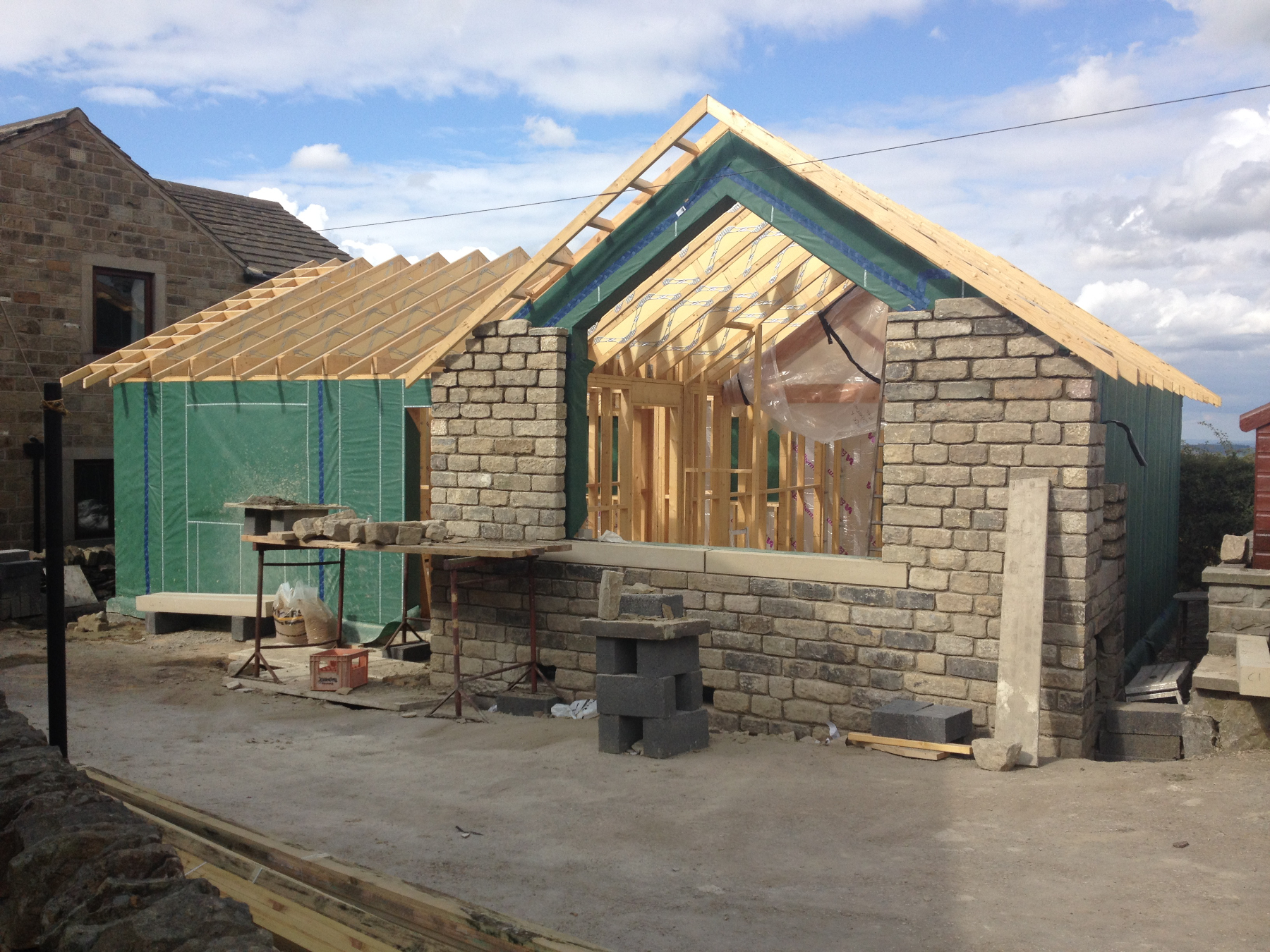 Installation of the stone facing to the gable end