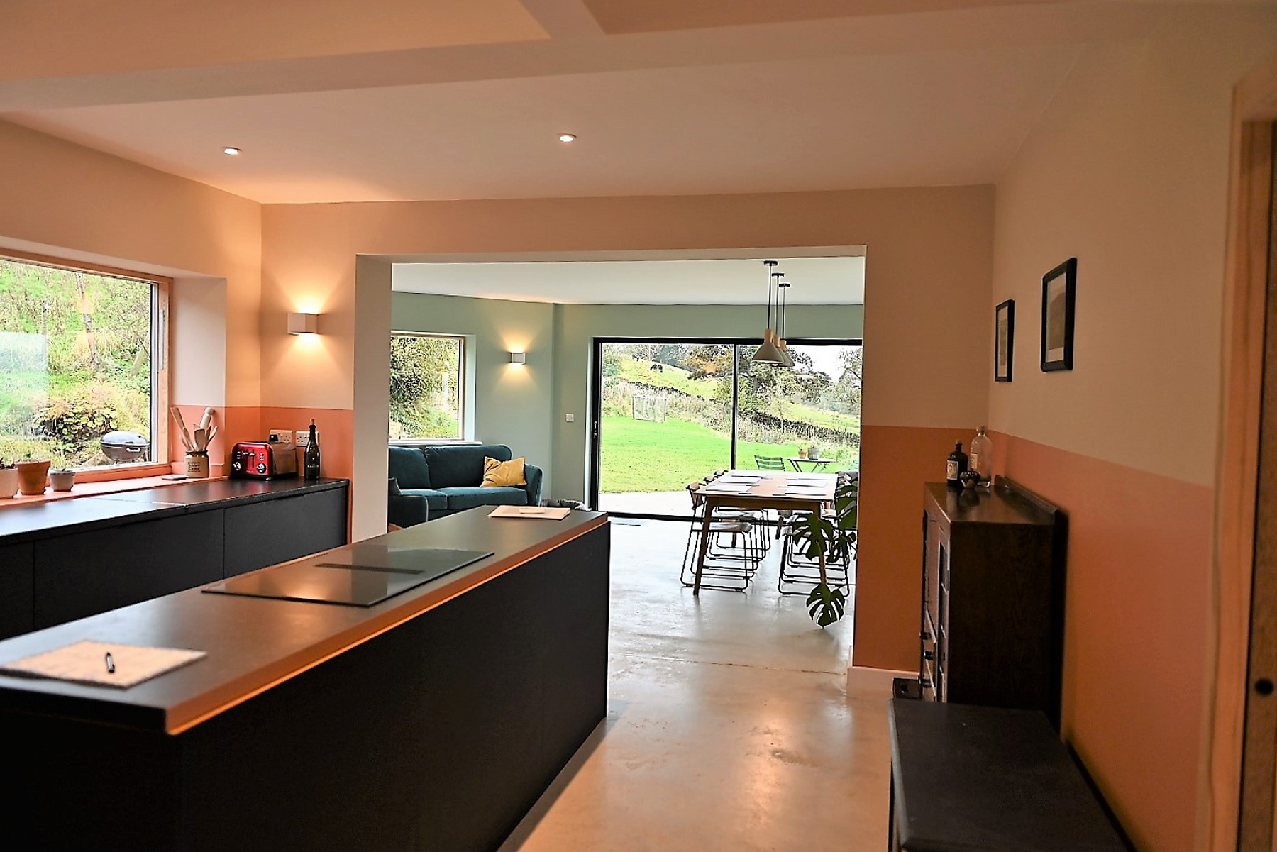 Large windows and glazed doors maximise the amount of natural light in the kitchen / living space