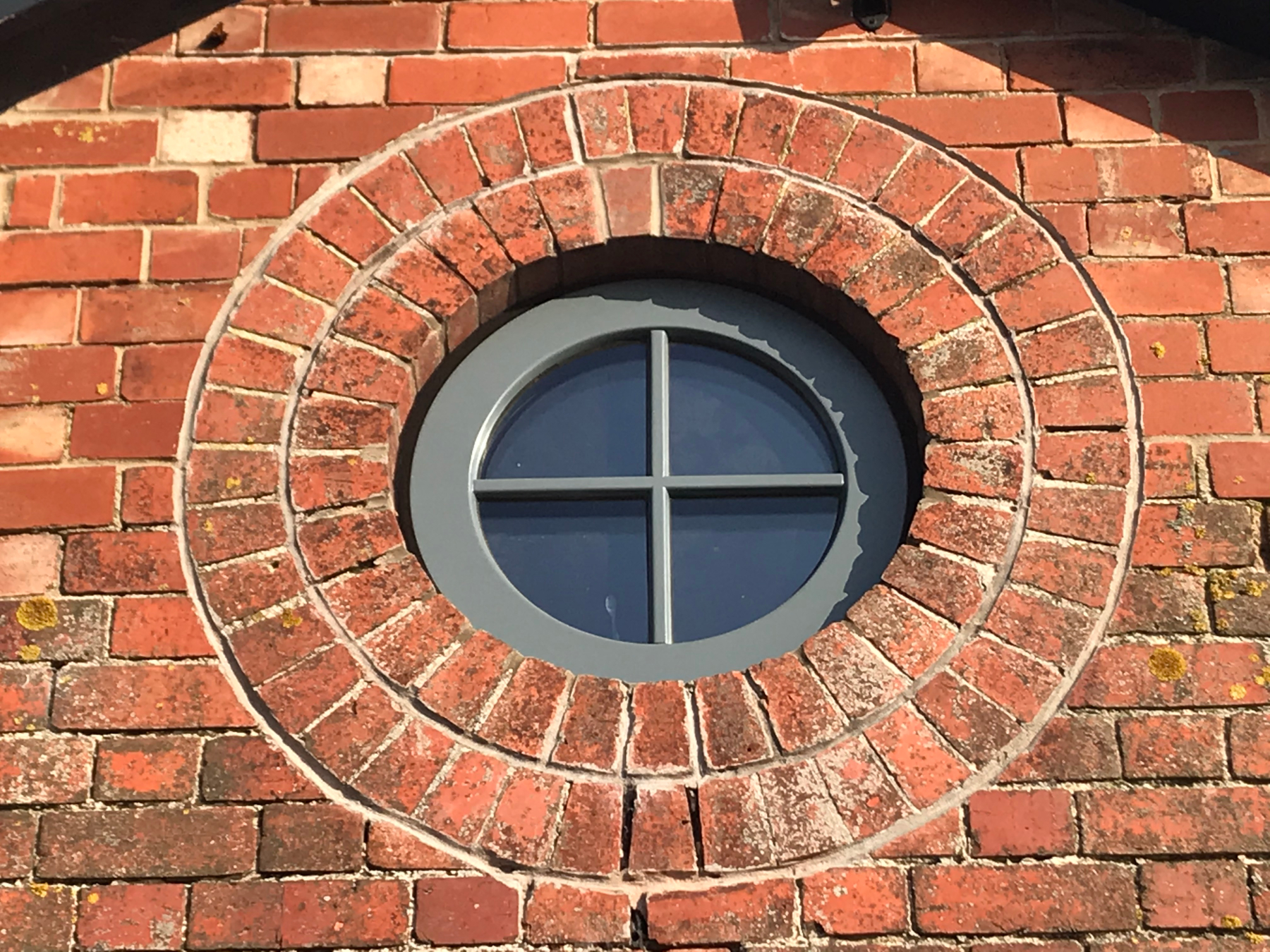 Porthole window following masonry repairs including joint reinforcement